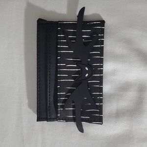 This item is a Nightmare Before Christmas Jack Skellington-themed card holder. I